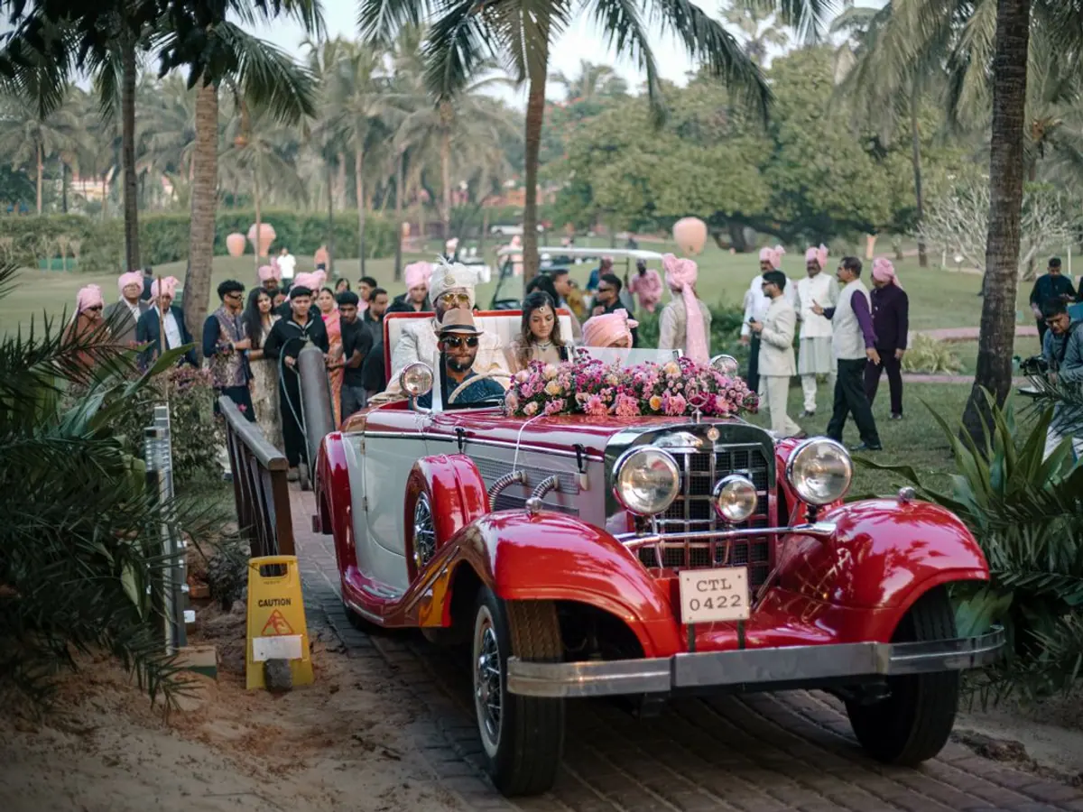 Decorated wedding car arriving with the baraat